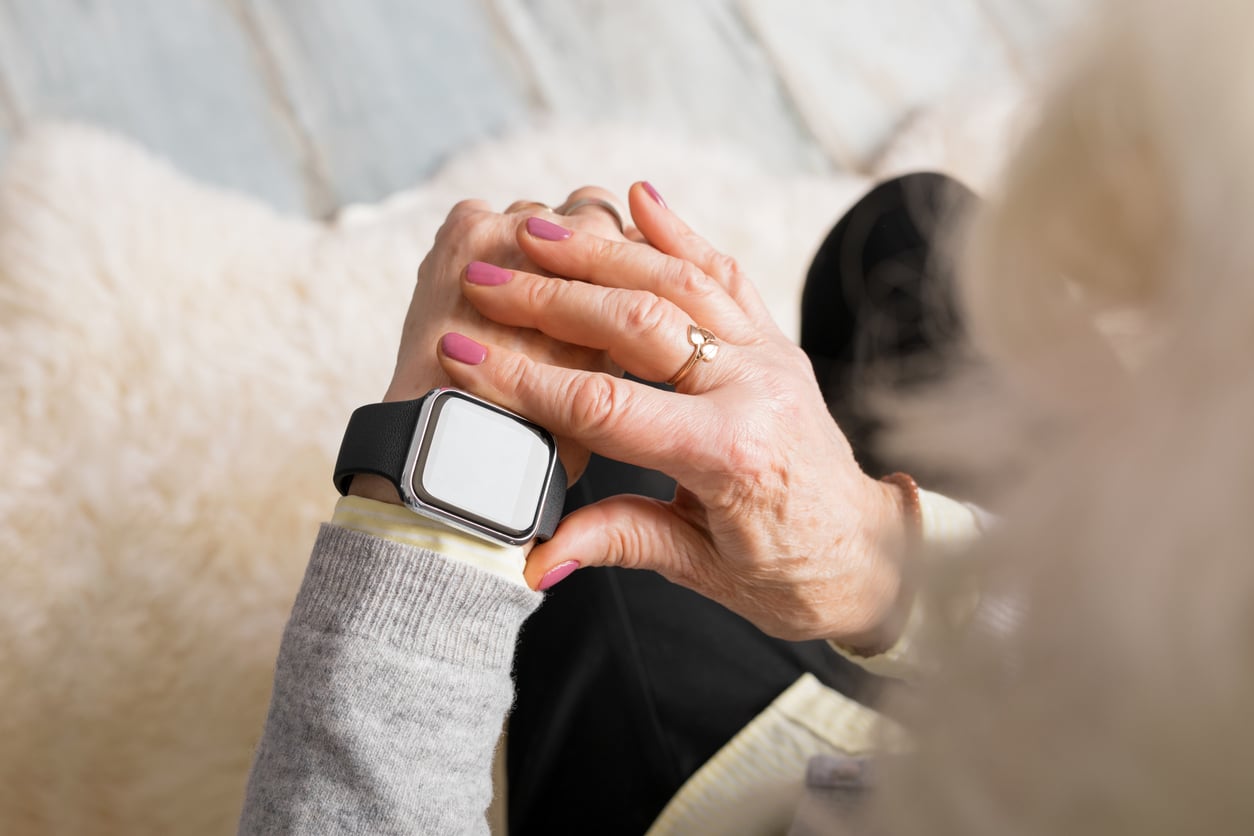 Old person using smart watch